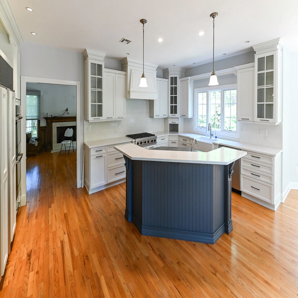 "The Montgomery" Transitional White Kitchen with Blue Island & Appliances